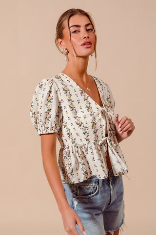 Short sleeve detail on lightweight floral smocked hem blouse