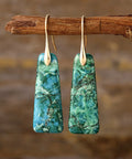 Green natural stone drop earrings with gold-plated hooks, featuring a marbled texture.