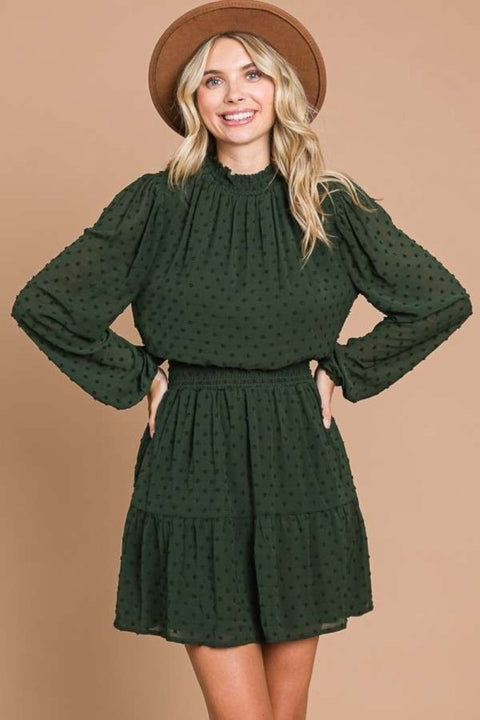 Green Swiss dot smock neck mini dress with long sleeves and tiered silhouette