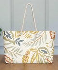 Front view of oversized weekender tote bag with harvest leaf print and rope handles