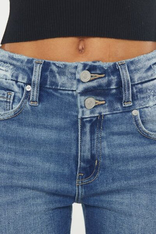 Close-up of wide waistband and pocket detail on high rise jeans