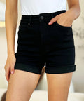 Black high-waisted shorts with stretch fabric and pockets.