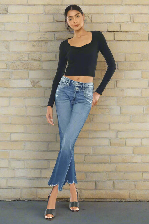 Woman wearing high rise wide waistband jeans with raw hem