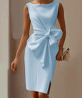woman wearing light blue bow detail midi dress with elegant fitted silhouette
