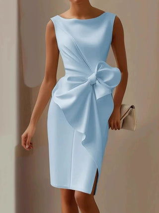 woman wearing light blue bow detail midi dress with elegant fitted silhouette
