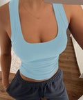 Light blue ribbed square neck tank top styled with relaxed pants for an effortless casual outfit.