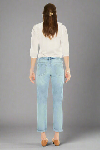 Back view of cropped light wash jeans with clean pocket detail