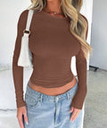 Woman wearing brown fitted long sleeve top