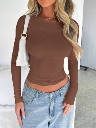 Woman wearing brown fitted long sleeve top