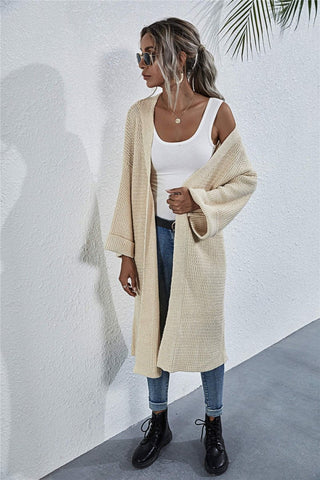 Side view of model in open-front cardigan