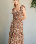 Full-length view of mocha floral dress with tiered skirt and romantic silhouette