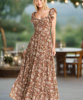 Left side view of flowy mocha floral maxi dress with fluttery cap sleeves