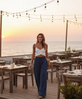 navy wide leg pants with pockets styled for travel and everyday wear