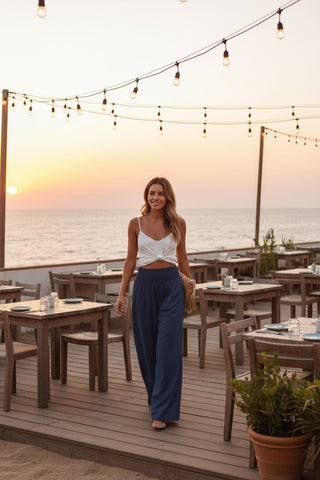 navy wide leg pants with pockets styled for travel and everyday wear