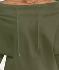 Close-up of olive off-shoulder neckline and drawstring detail