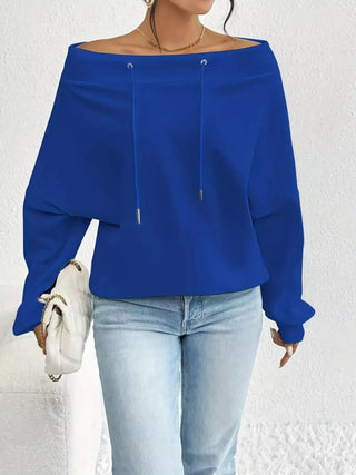 Royal blue off-shoulder long sleeve top styled for a spring outfit