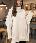 Woman wearing cream oversized knit sweater