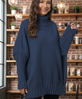 Woman wearing navy blue oversized turtleneck sweater