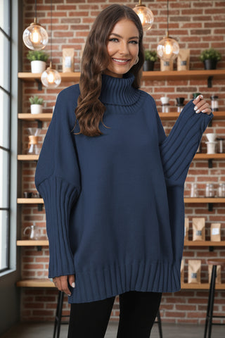 Woman wearing navy blue oversized turtleneck sweater