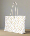 Angled side view of weekender tote bag with gold leaf pattern