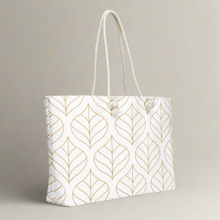 Side view of large tote bag featuring gold leaf design