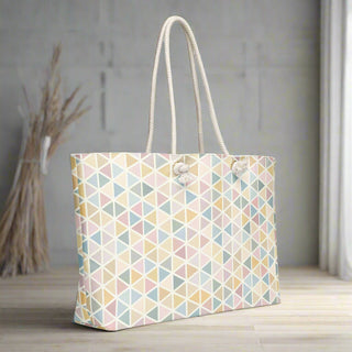 Front view of oversized pastel geometric weekender tote with rope handles