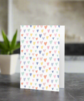 Pastel multicolor hearts greeting card on premium paperboard, blank inside