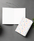Inside view of pastel hearts greeting card showing blank interior for personal message