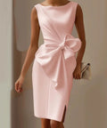 woman wearing blush pink bow detail midi dress with elegant sleeveless styling