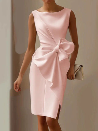 woman wearing blush pink bow detail midi dress with elegant sleeveless styling