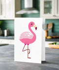 Pink Flamingo Greeting Card standing on a kitchen counter – blank inside with tropical bird design and envelope