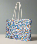 Abstract mosaic pattern tote bag standing on tabletop


