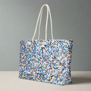 Abstract mosaic pattern tote bag standing on tabletop

