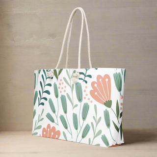 Oversized floral canvas tote styled with indoor plant for spring and summer vibes