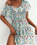 woman wearing printed ruched mesh mini dress for summer vacation outfit