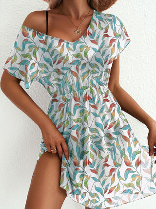 woman wearing printed ruched mesh mini dress for summer vacation outfit