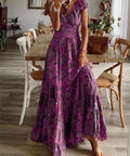 woman wearing purple boho smocked maxi dress with flowing floral print