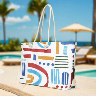 Side view of colorful rainbow arc travel tote with rope handles