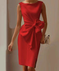 woman wearing red bow detail midi dress styled for cocktail parties and special occasions