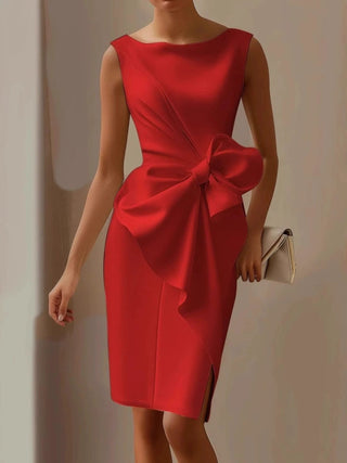 woman wearing red bow detail midi dress styled for cocktail parties and special occasions