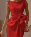 red occasion dress with oversized bow accent and sophisticated fitted silhouette