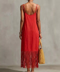 back view of red spaghetti strap maxi dress with fringe hem detail