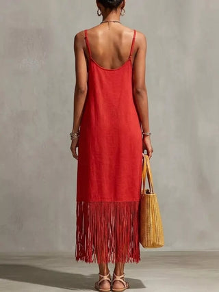 back view of red spaghetti strap maxi dress with fringe hem detail