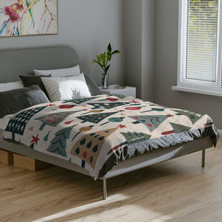 Blanket styled on bed with retro Christmas print