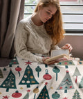 Woman reading with retro Christmas tree velveteen blanket