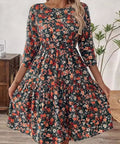 Flowy floral dress with ruched bodice, perfect for daytime wear