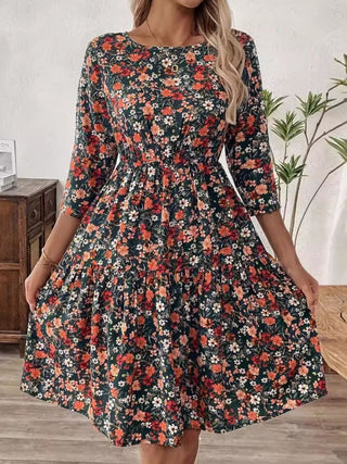 Flowy floral dress with ruched bodice, perfect for daytime wear