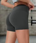 Rear view of charcoal compression shorts showing contour and seam-free fit