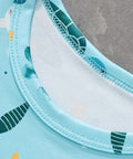 close up of round neck collar on kids sea turtle print shirt