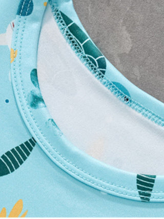 close up of round neck collar on kids sea turtle print shirt